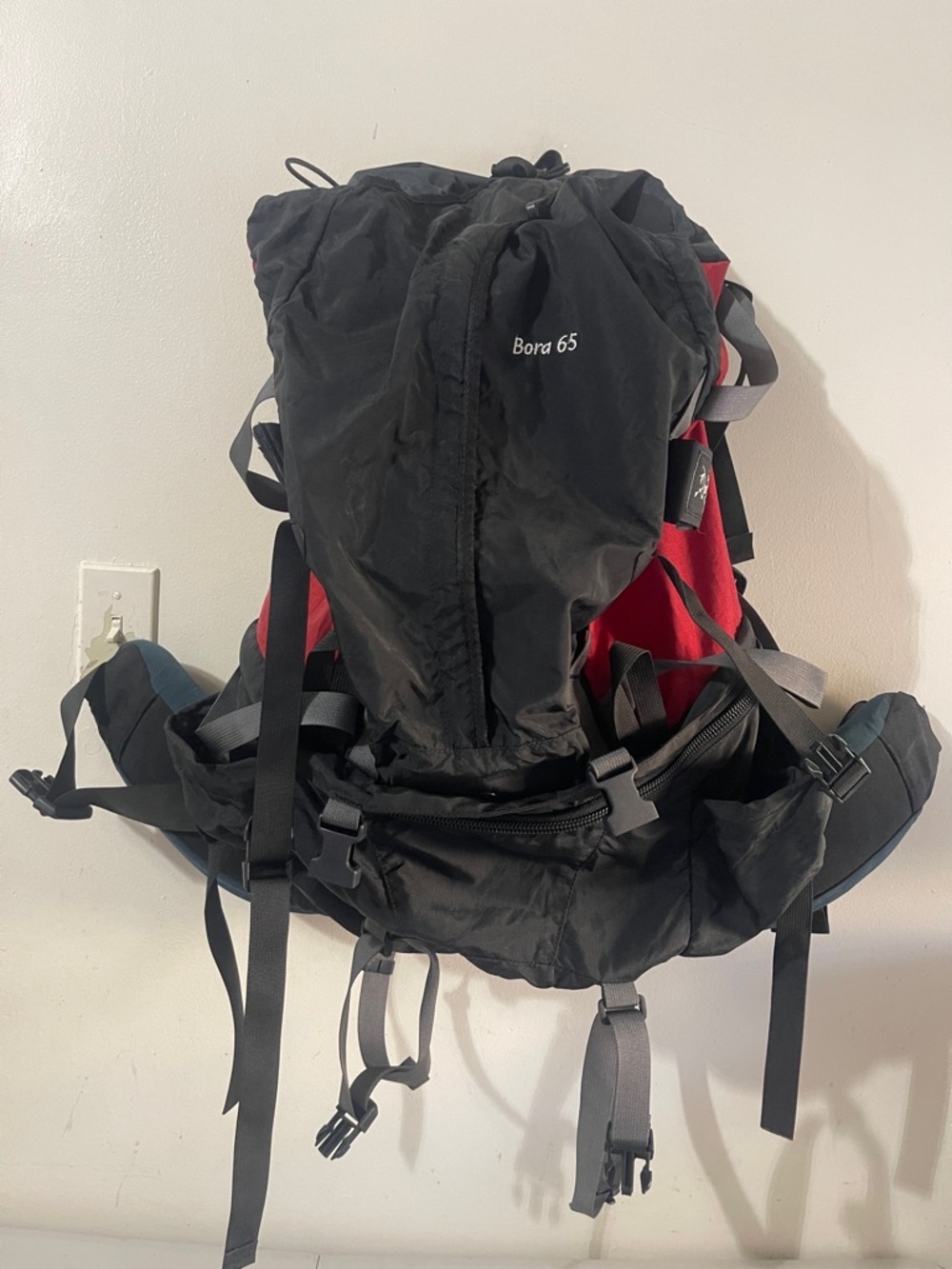 Arc'teryx Black and Red Backpack with Gray Straps